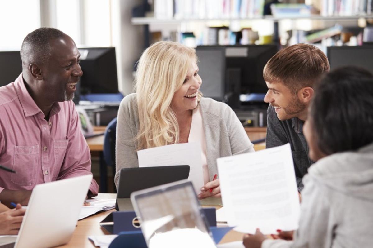 students discussing work